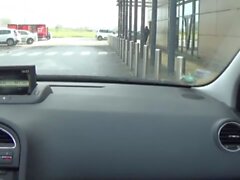 crossdresser sissy by car on the road in the parking lo